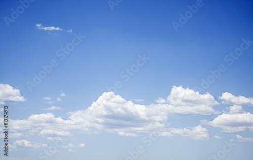 Blue sky background with clouds in spring