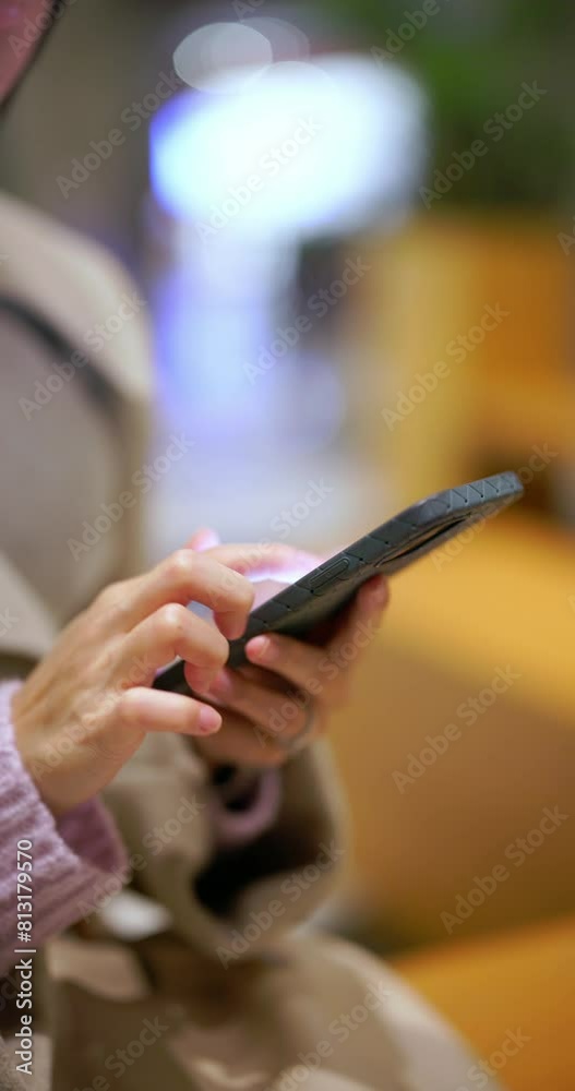 Vertical view of woman use cellphone at night Vertical view of woman use cellphone at night