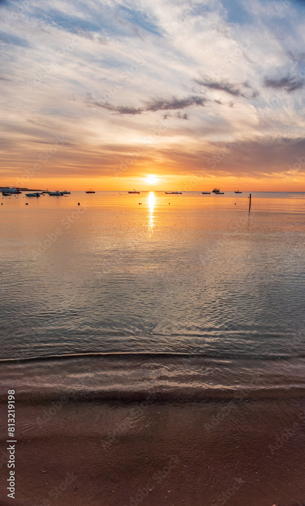 Fototapeta premium Beautiful red and orange sunrise over the sea.