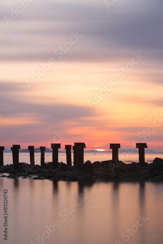 Fototapeta Naklejka Na Ścianę i Meble -  sunset on the beach. Seaside town of Turgutreis and spectacular sunsets. Selective Focus. Long Exposure shoot. tranquility scene.