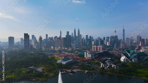 Aerial Hyperlapse of Kuala lumpur city with lake view overseeing Kuala lumpur city during sunrise
