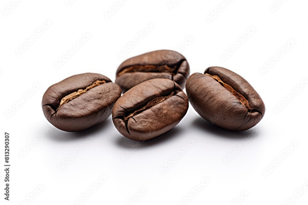 Coffee beans on isolated white surface closeup Coffee beans on isolated white surface closeup