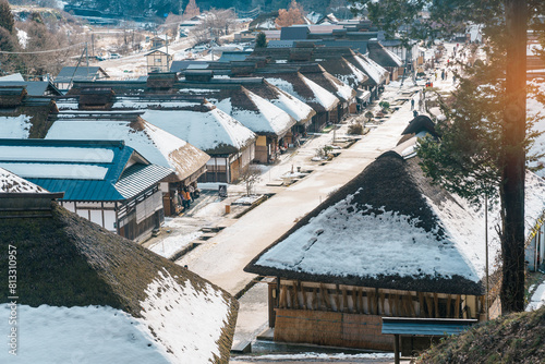 Ouchi Juku ancient farmer house village with snow in winter, former post town along the Aizu-Nishi Kaido trade route during the Edo Period. Shimogo town, Minamiaizu, Fukushima Prefecture, Japan photo