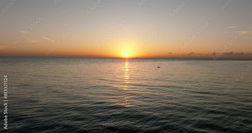 The sunset paints the sky over the tranquil lake with a warm afterglow The sunset paints the sky over the tranquil lake with a warm afterglow