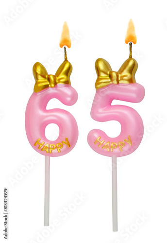 Burning pink birthday candles isolated on white background. Number 65.