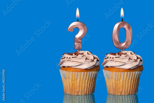 Birthday Cupcakes with Lit Question Mark Candle and Number 0