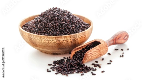 Black rice in a wooden scoop and bowl isolated on white background  