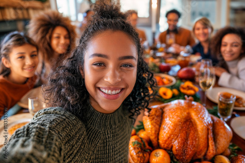 Young woman takes festive selfie with multi-generational family at Thanksgiving dinner  joyous holiday gathering