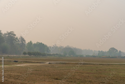 Countryside landscape mountains covered by smoke from fire forest burn, pollution problem pm. 2.5