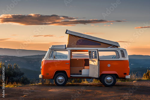 Vintage Camper Van against Spectacular Mountainous Landscape at Dusk