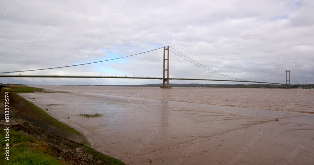 extra wide shot of the Humber bridge showing exposed mud flats on the Humber estuary. extra wide shot of the Humber bridge showing exposed mud flats on the Humber estuary.
