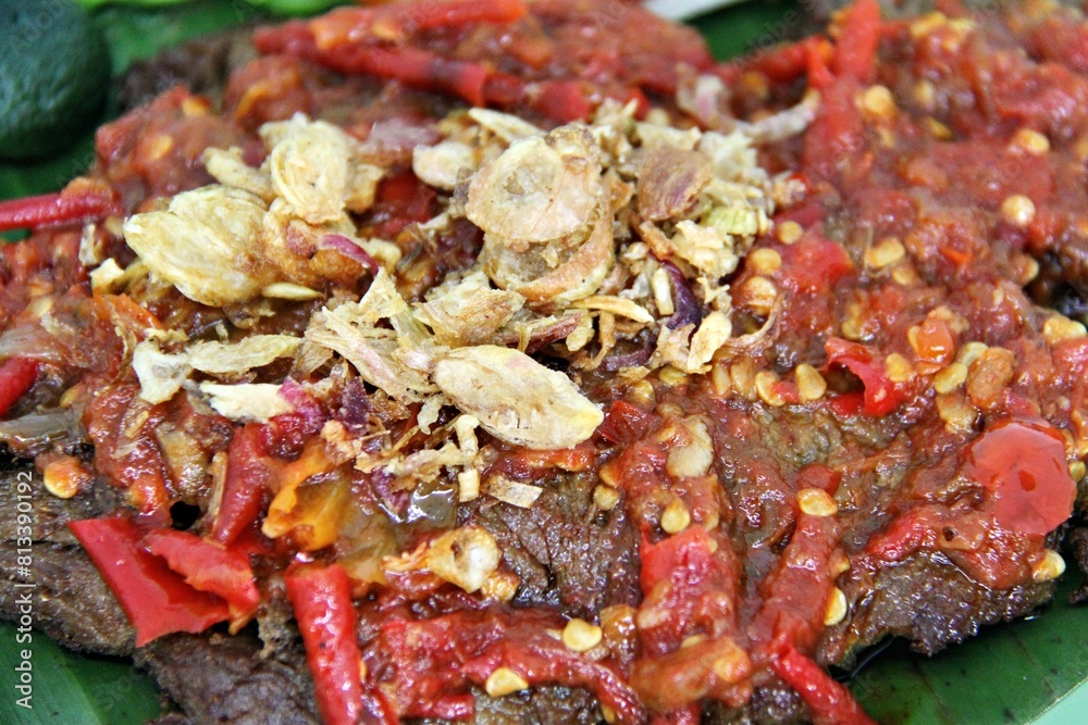 Empal Penyet consists of deep-seated beef cooked with kitchen spices such as bay leaves, galangal, lime leaves, tamarind, shallots, garlic, and many more. Empal Penyet consists of deep-seated beef cooked with kitchen spices such as bay leaves, galangal, lime leaves, tamarind, shallots, garlic, and many more.