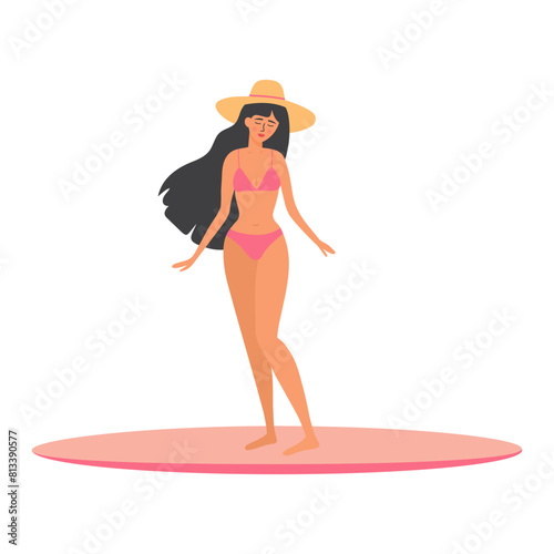Beautiful tanned girl in swimsuit and hat standing on a surfboard. Woman relaxing and sunbathing. Summer vacation, holiday, travel, leisure.