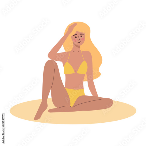 Beautiful tanned girl in swimsuit sitting. Woman relaxing and sunbathing. Summer vacation, holiday, travel, leisure.