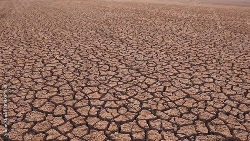 Draught land of Kutch desert. Natural pattern of desert land. Cracked, dry soil due to lack of water and hot weather in Little Rann of Kutch, Gujarat. Dehydrated and barren land during summer season