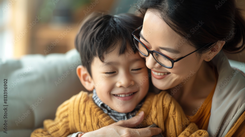 Affectionate moment between smiling Chinese mother and Chinese son at home, showcasing a warm, loving family dynamic Affectionate moment between smiling Chinese mother and Chinese son at home, showcasing a warm, loving family dynamic