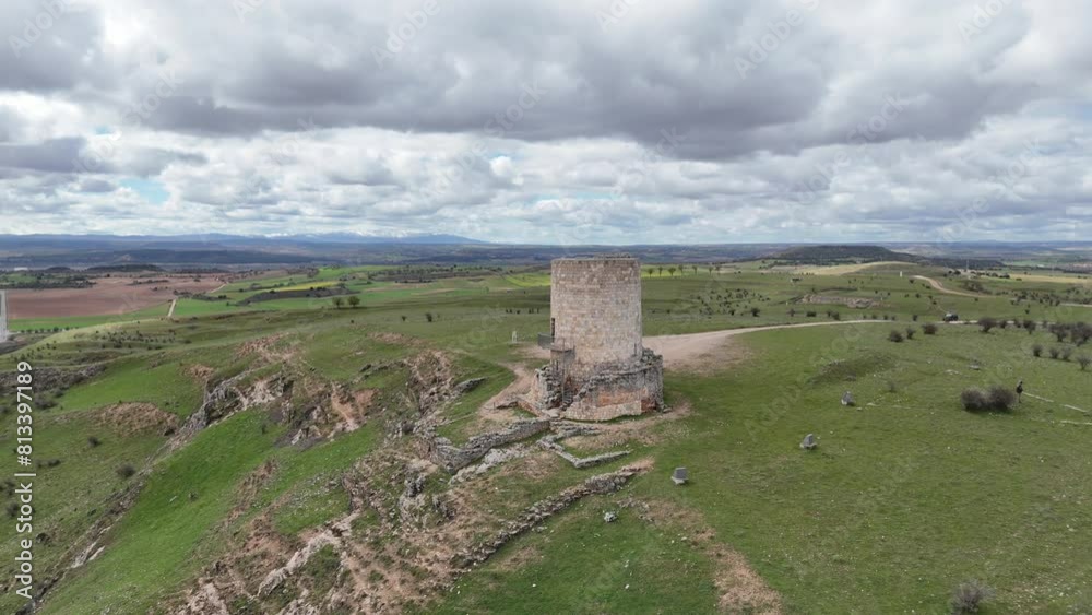 Aerial dron spinning flight of an isolated medieval watch tower in Burgo de Osma, Soria, Spain. 4K 60FPS Aerial dron spinning flight of an isolated medieval watch tower in Burgo de Osma, Soria, Spain. 4K 60FPS