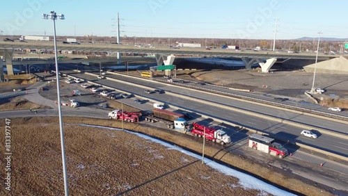 Aerial View Of Fallen cargo container recovery operation after rollover near exit ramp from the Champlain Bridge In Brossard, Montreal, Canada  photo
