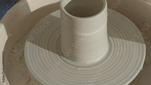 a vase spinning on the pottery wheel photo