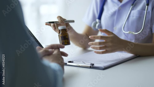 Doctor who records a patient's detailed information or medication history is evaluating medications and vaccines for the intended treatment. or if there are any side effects. photo