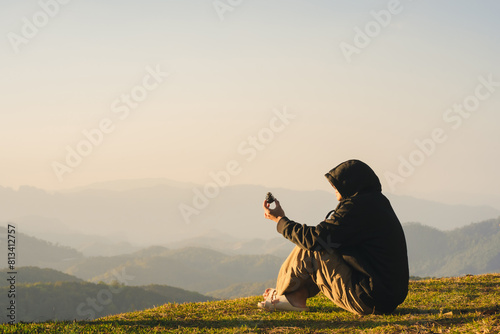 nature traveling with solo man relax and see sunrise with layer of mountain