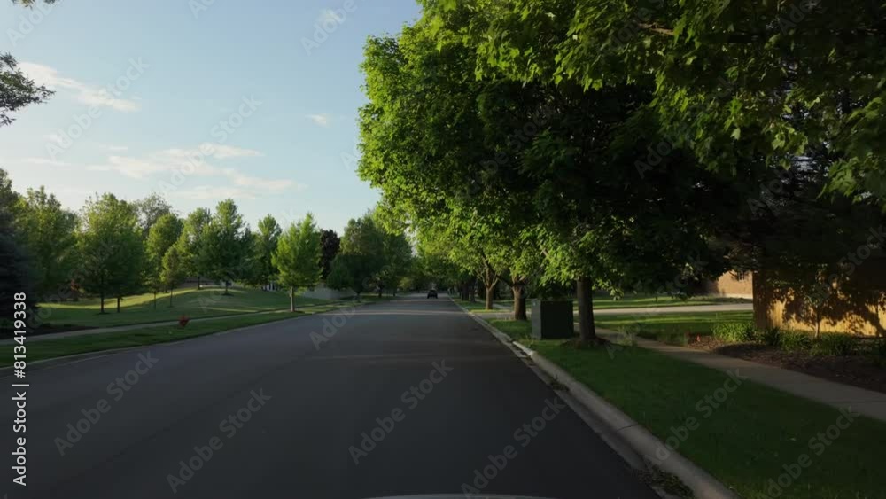 POV shot of suburban street in USA neighborhood on a beautiful spring day POV shot of suburban street in USA neighborhood on a beautiful spring day