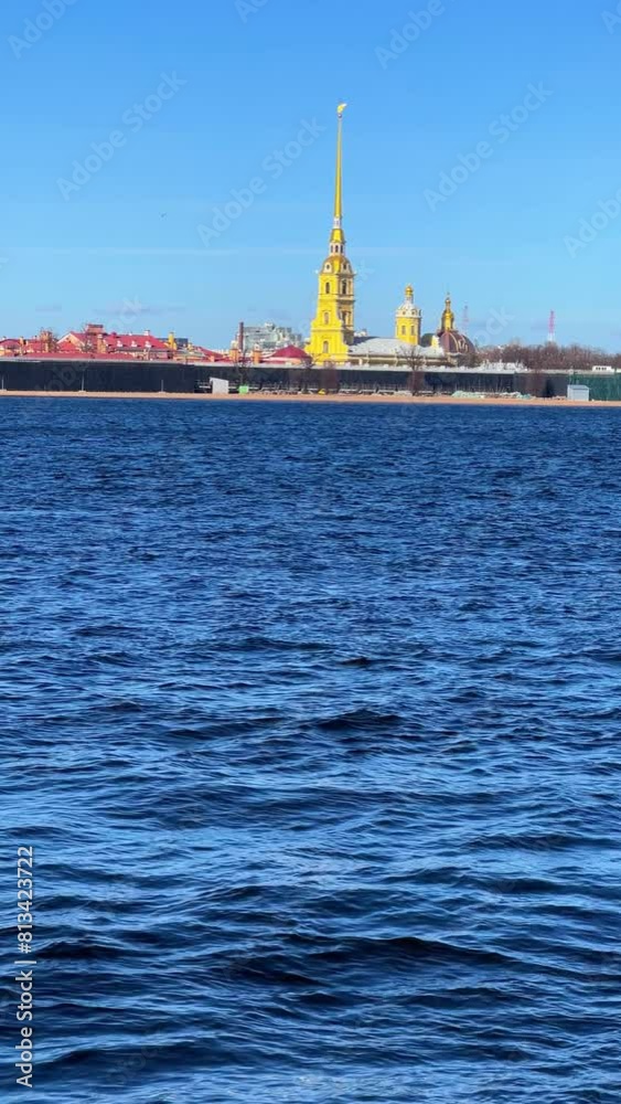 St. Petersburg, Russia - April 20, 2024. View of the sights of the city from the Neva River embankment. Panoramic view of the Neva River and Peter and Paul Fortress, on Zayachy Island. 4К St. Petersburg, Russia - April 20, 2024. View of the sights of the city from the Neva River embankment. Panoramic view of the Neva River and Peter and Paul Fortress, on Zayachy Island. 4К