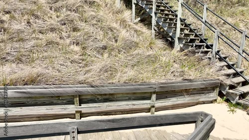 Dune grass against old lumber stairs. photo