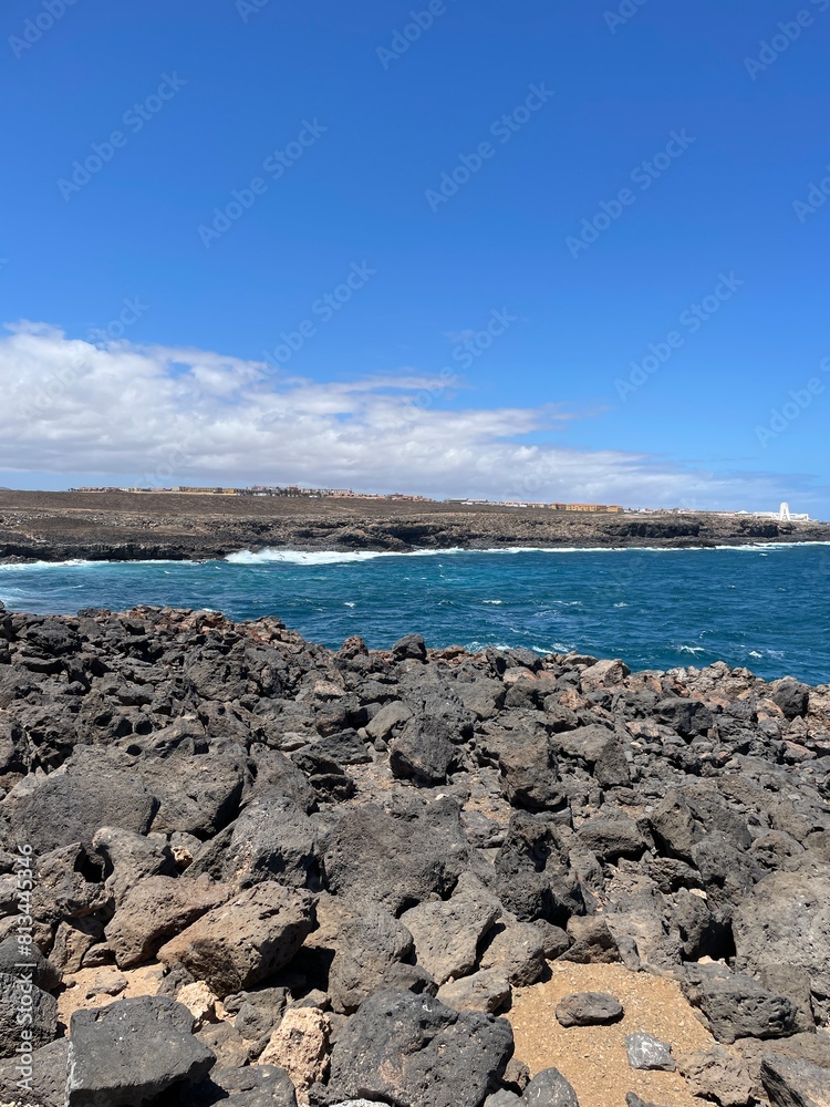 large beach with volcanic stones large beach with volcanic stones