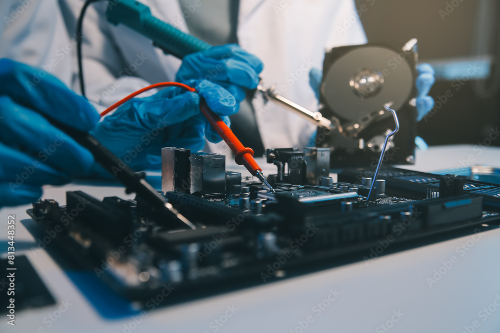 Obraz premium Close up of Technician measuring voltage electronic circuit board television, Service after sale fix electric equipment within insurance.