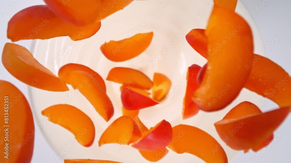 Super Slow Motion Shot of Apricot Cuts Followed by Camera Falling into Yogurt at 1000fps. Super Slow Motion Shot of Apricot Cuts Followed by Camera Falling into Yogurt at 1000fps.