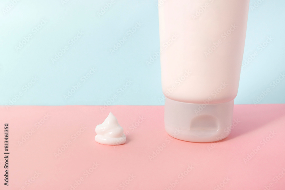 Clean label facial or body cream tube and product squeezed cream texture is isolated on a pink background. Branding spa. Cream bottle, lotion, mousse, cleanser, shampoo for skincare routine Clean label facial or body cream tube and product squeezed cream texture is isolated on a pink background. Branding spa. Cream bottle, lotion, mousse, cleanser, shampoo for skincare routine