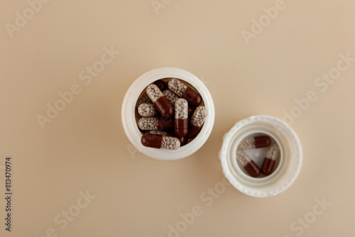 Opened packaging with Creon capsules, top view. Selective focus. Capsules filled with gastro-resistant granules. Pancreatic enzymes, also known as pancreases or pancrelipase and pancreatin photo