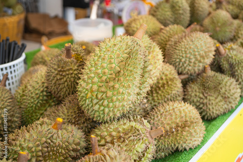 Group of fresh durians are on a table in the durian market. photo