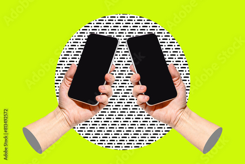 Two hands with smart phones on bright green background photo