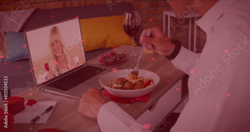 Caucasian couple enjoying virtual dinner date, boyfriend holding wine glass