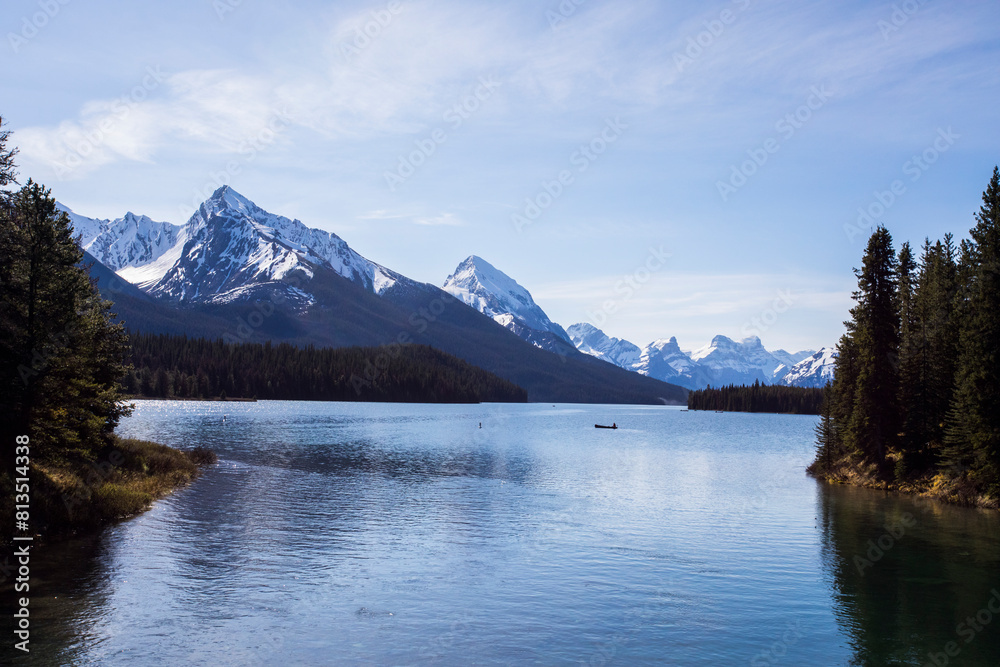 Summer landscape and people kayaking and fishing in Maligne lake, Jasper National Park, Canada