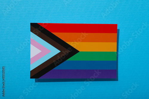 LGBT parade concept, festive colorful symbols on blue background.