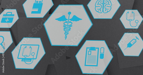 Image of multiple medical icons moving against textured grey background