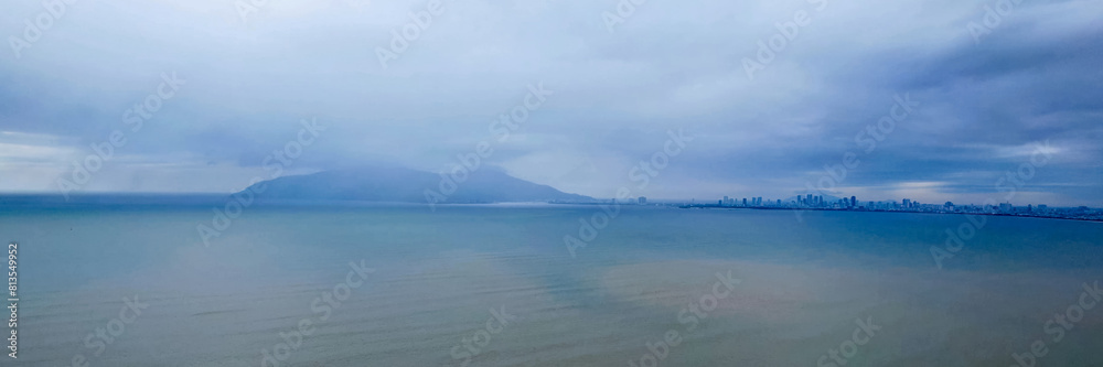 View from drone to the ocean and mountain before the rain View from drone to the ocean and mountain before the rain