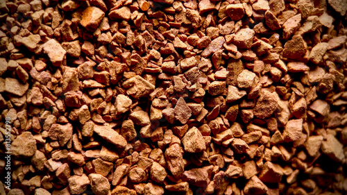 Close-up of instant coffee granules texture, ideal for food and beverage industry themes and International Coffee Day promotions