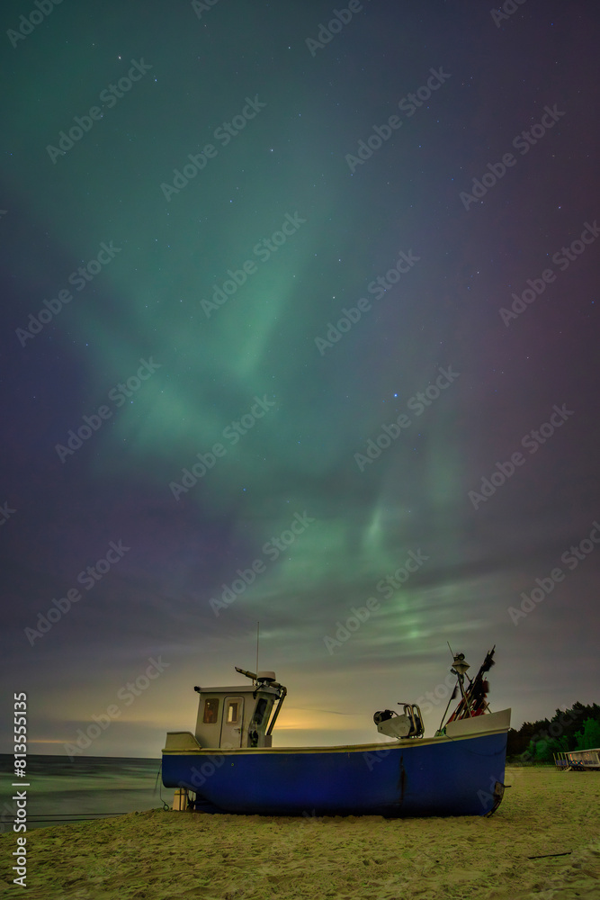 Aurora over the Baltic Sea on the beach in Katy Rybackie with fishing boat in Poland. Aurora over the Baltic Sea on the beach in Katy Rybackie with fishing boat in Poland.