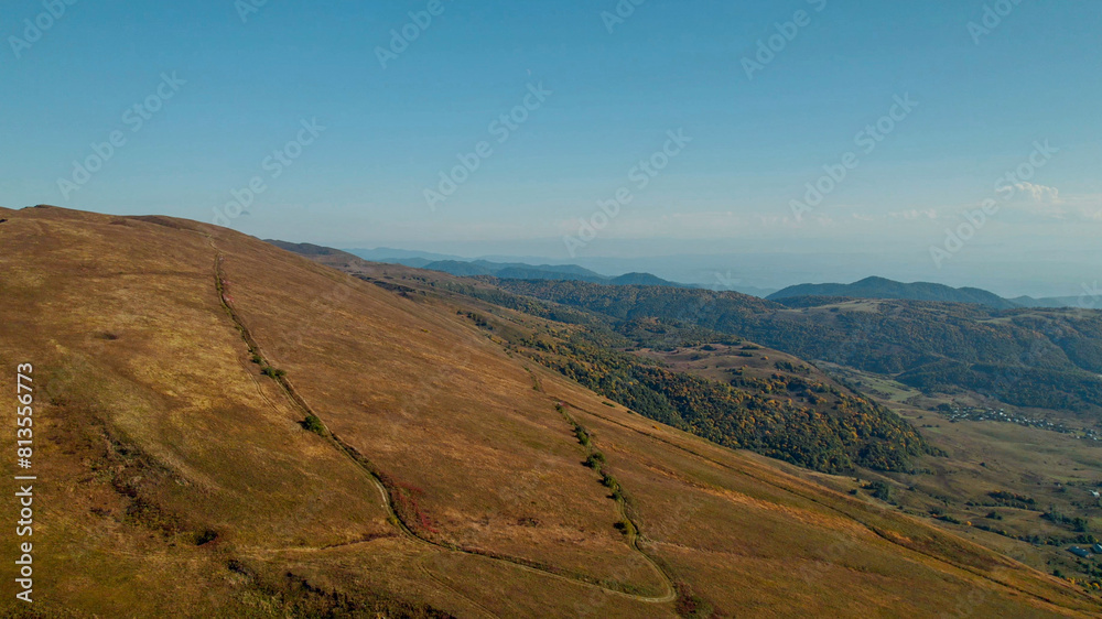 Breathtaking aerial view of a golden autumn landscape in the rolling hills, ideal for travel themes and exploring the beauty of nature Breathtaking aerial view of a golden autumn landscape in the rolling hills, ideal for travel themes and exploring the beauty of nature
