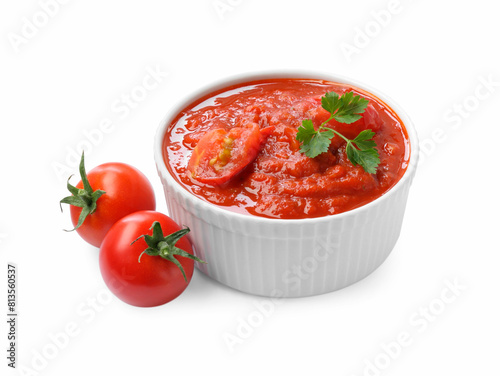 Homemade tomato sauce in bowl and fresh ingredients isolated on white