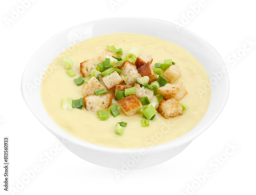 Tasty potato soup with croutons and green onion in bowl isolated on white