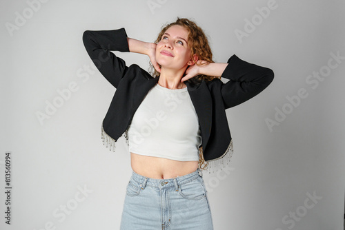 Young Woman With Curly Hair Portrait against gray background