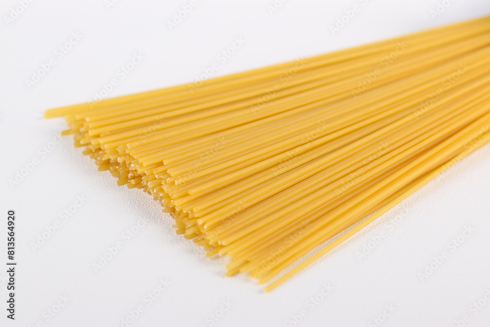 Uncooked spaghetti pasta isolated on a white background. Uncooked spaghetti pasta isolated on a white background.