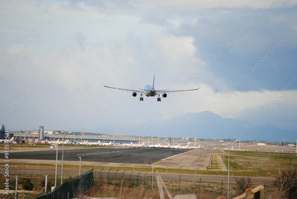 Flight taking off and flying over the Airport Runway under blue sky Flight taking off and flying over the Airport Runway under blue sky