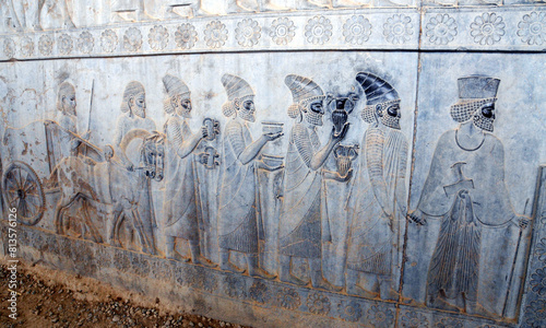 Bas reliefs that depict delegations from across the Persian empire bringing tribute to the Achaemenid kings in Persepolis, Iran photo