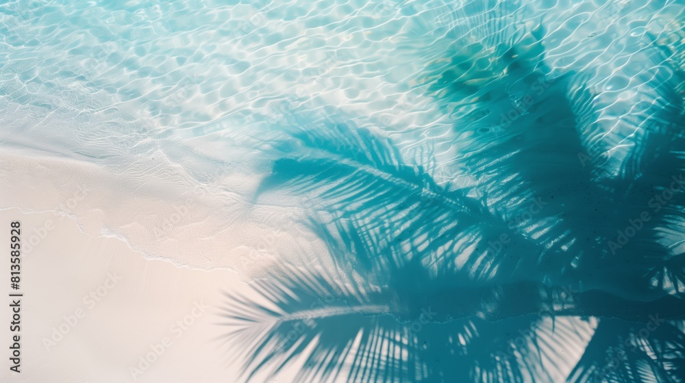 An azure seashore with clear sea water and sand and shade under the leaves of palm trees. Summer An azure seashore with clear sea water and sand and shade under the leaves of palm trees. Summer